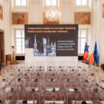 Conference hall prepared with Czech and European flags in Prague