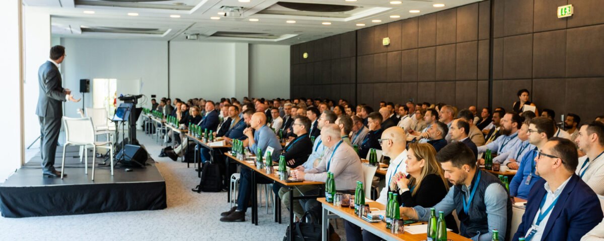 Delegates seated in a conference hall during a Prague summit