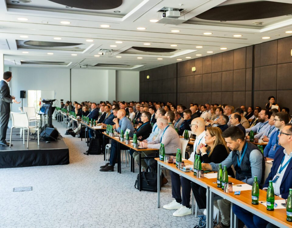 Delegates seated in a conference hall during a Prague summit