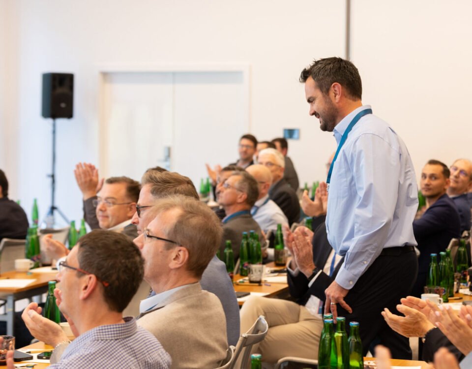 Guests applauding during a corporate conference in Prague