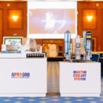 Press conference stage with product models at a Prague industry event