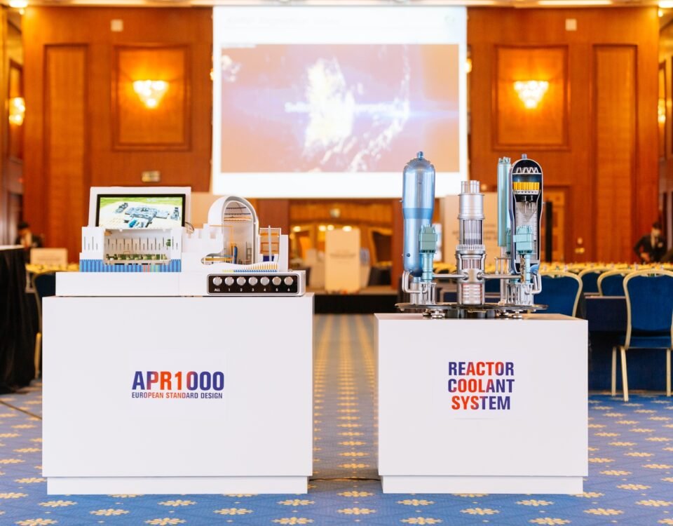 Press conference stage with product models at a Prague industry event