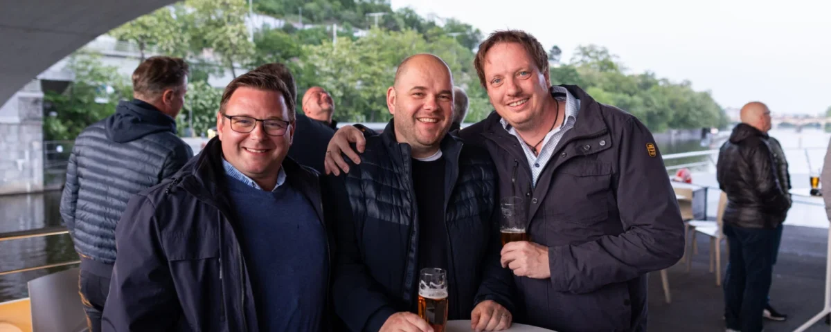 Guests networking at an outdoor reception in Prague