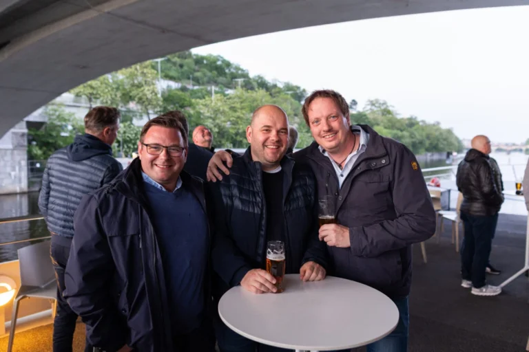Guests networking at an outdoor reception in Prague