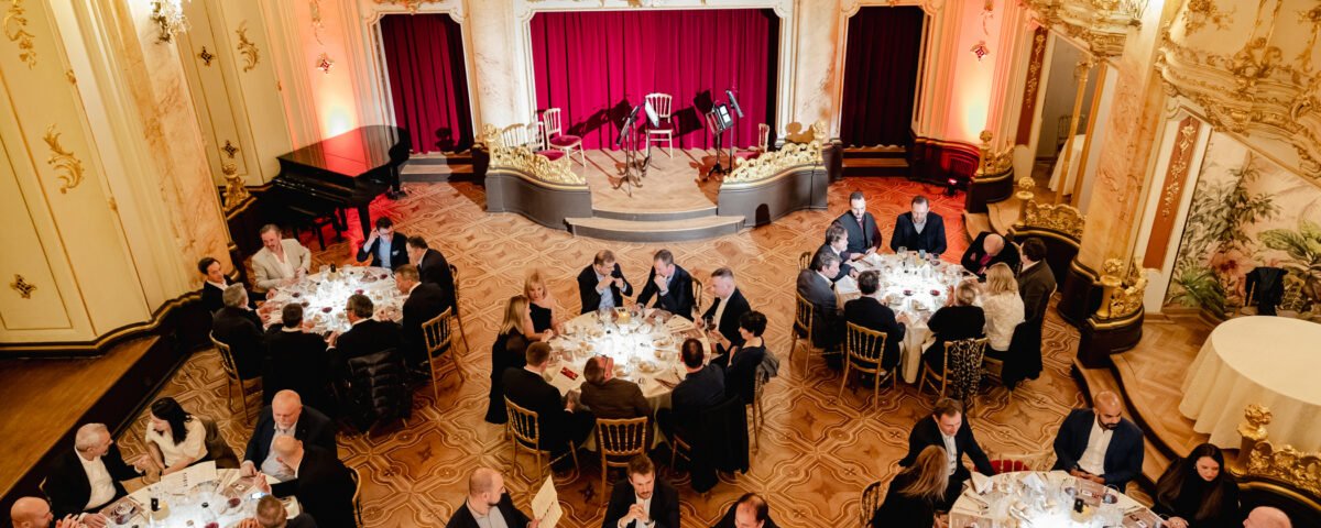 Gala dinner in a historic Prague hall seen from above