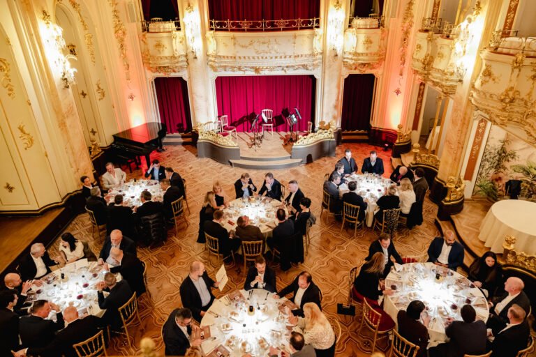 Gala dinner in a historic Prague hall seen from above