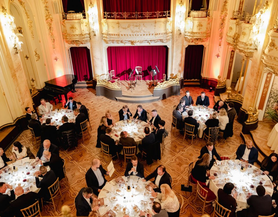 Gala dinner in a historic Prague hall seen from above