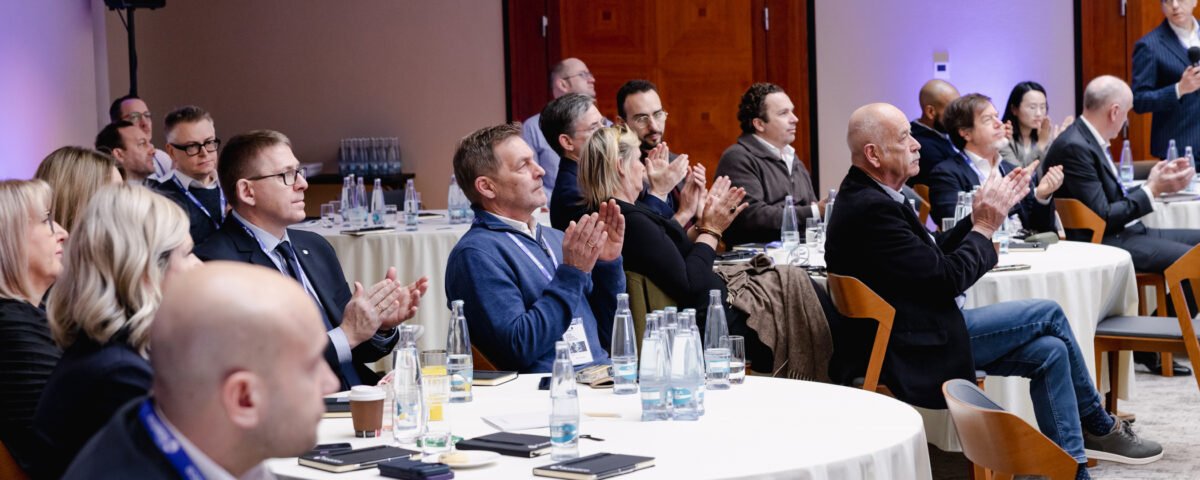 Guests at a corporate dinner presentation in Prague