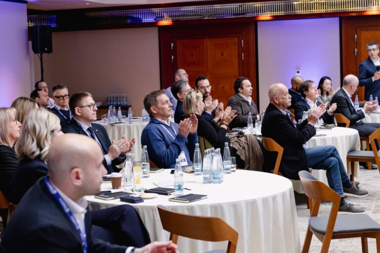 Guests at a corporate dinner presentation in Prague