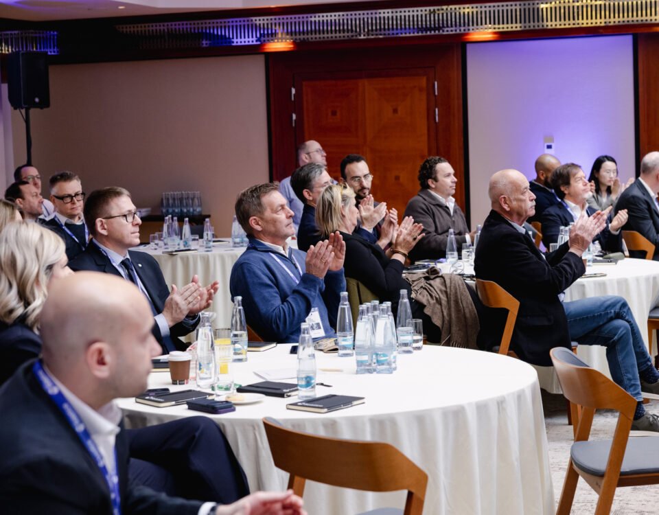 Guests at a corporate dinner presentation in Prague