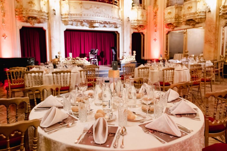 Gala dinner tables in an ornate Prague ballroom