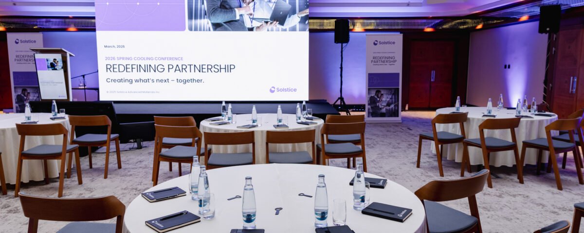 Round-table corporate session with presentation screen in Prague