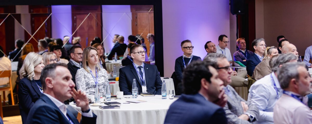 Audience listening to a presentation at a Prague corporate event