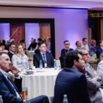 Audience listening to a presentation at a Prague corporate event