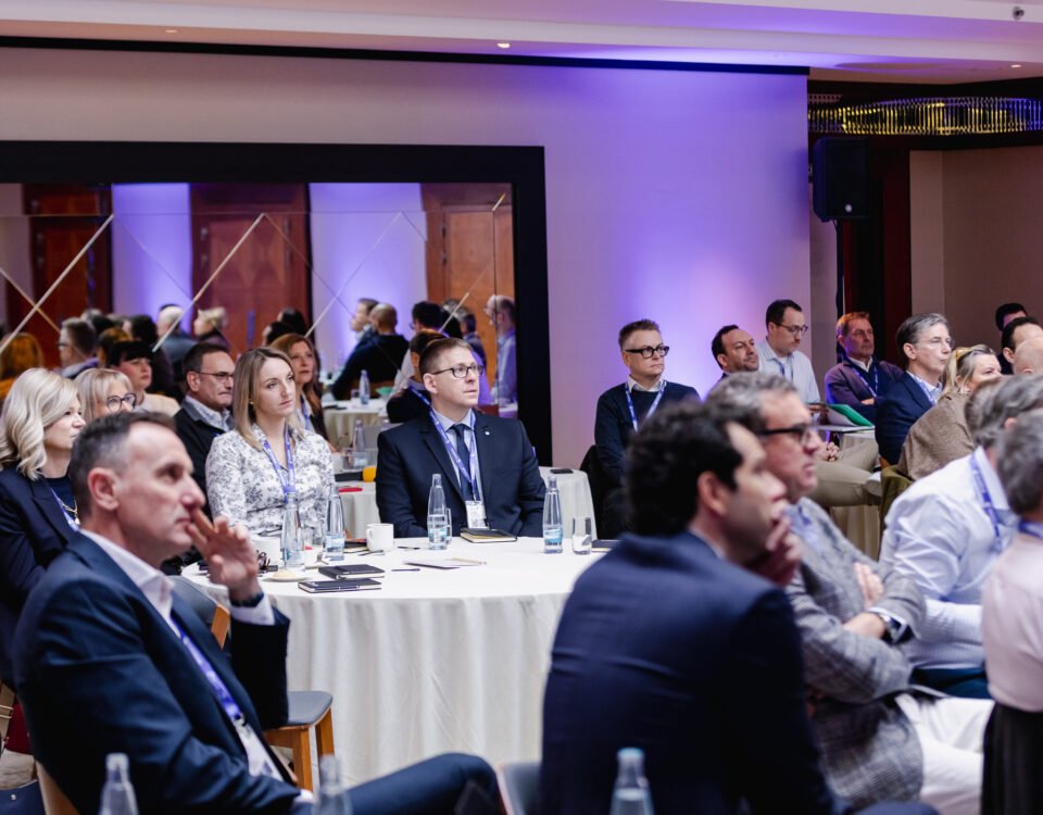 Audience listening to a presentation at a Prague corporate event