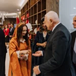 Guests greeting hosts at a diplomatic reception in Prague