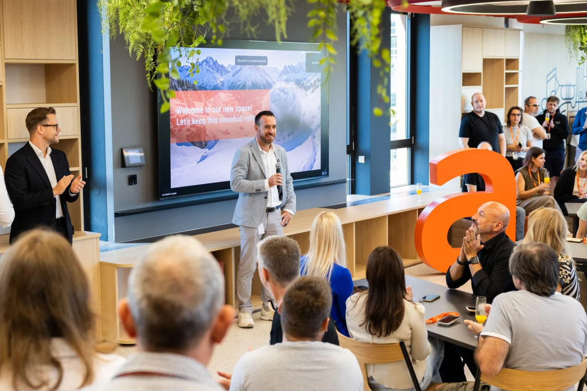 Speakers addressing guests at the opening of Allegro's new Prague office