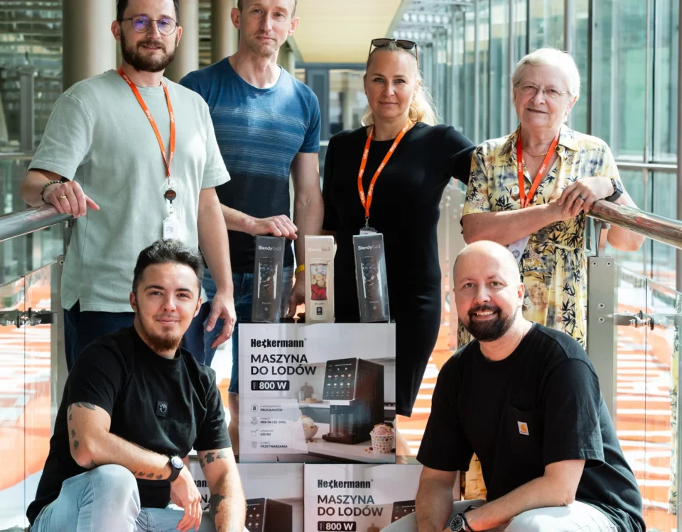 Group portrait of Allegro colleagues on the walkway at the Prague office opening
