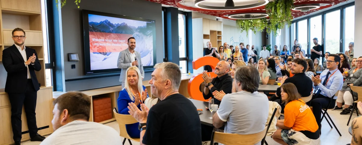 Employees seated for the opening speeches in Allegro's new Prague office