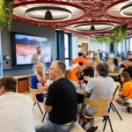 Employees seated for the opening speeches in Allegro's new Prague office