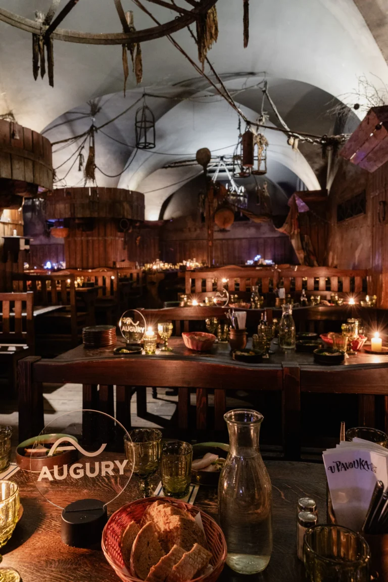 Company dinner in a candlelit medieval-style tavern in Prague