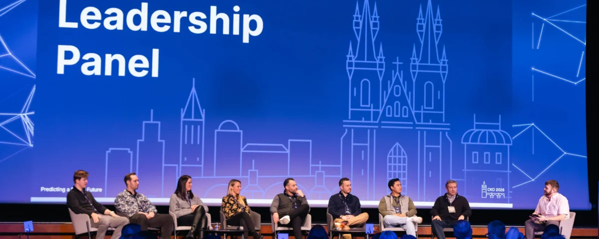 Leadership panel on stage at a company kick-off at Hilton Prague Atrium