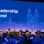 Leadership panel on stage at a company kick-off at Hilton Prague Atrium