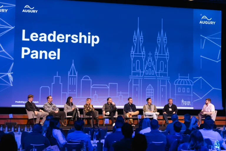 Leadership panel on stage at a company kick-off at Hilton Prague Atrium