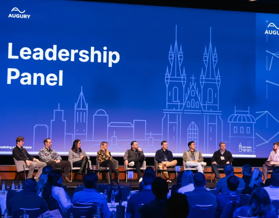 Leadership panel on stage at a company kick-off at Hilton Prague Atrium