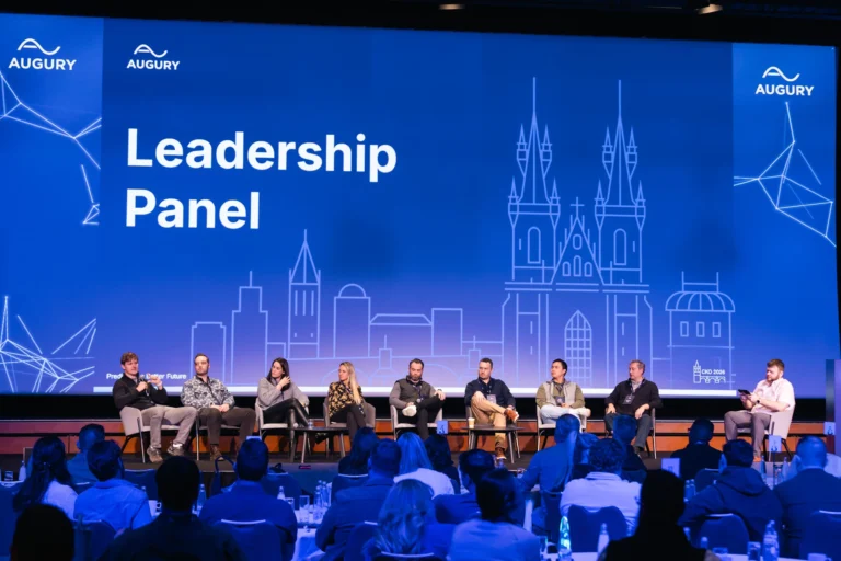 Leadership panel in front of a full hall at Hilton Prague Atrium