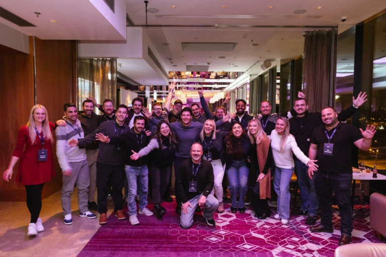 Team group photo at the evening reception at Hilton Prague Atrium