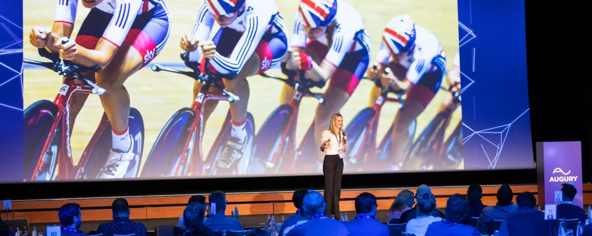 Keynote speaker on stage in the main hall of Hilton Prague Atrium