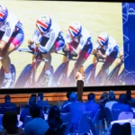 Keynote speaker on stage in the main hall of Hilton Prague Atrium
