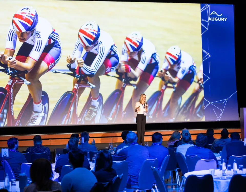 Keynote speaker on stage in the main hall of Hilton Prague Atrium