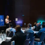 Speaker presenting in a breakout room at Hilton Prague Atrium