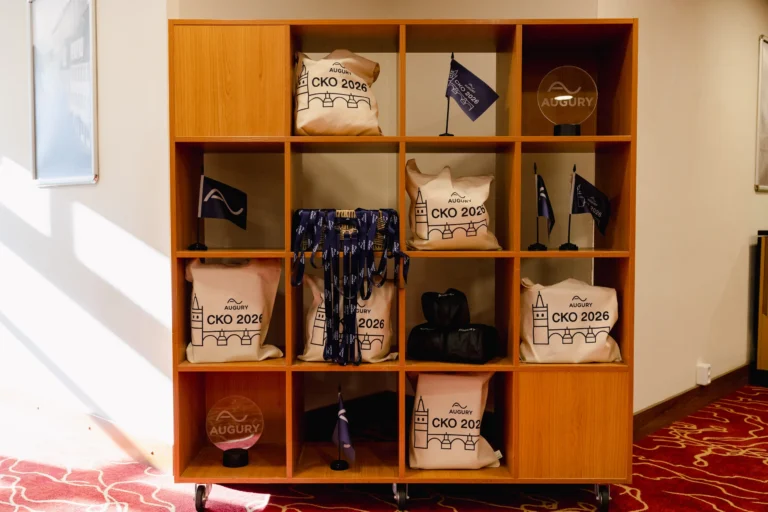 Shelf of branded merchandise for attendees at Hilton Prague Atrium