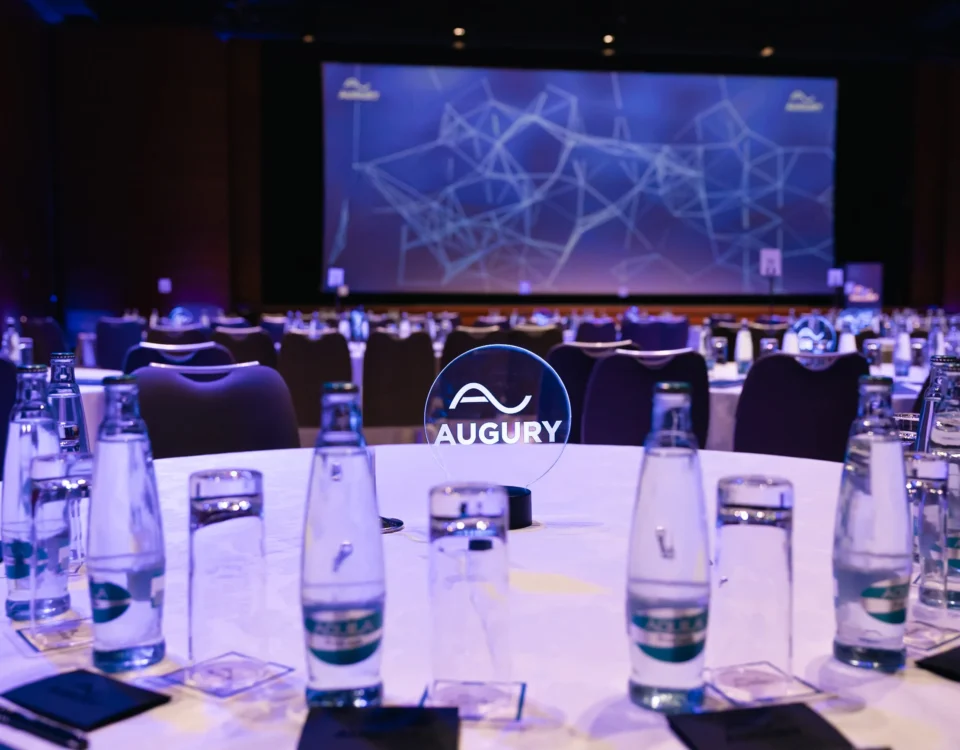 Round tables set in front of the stage in the main hall of Hilton Prague Atrium