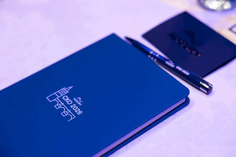Branded notebook and pen on a conference table at Hilton Prague Atrium