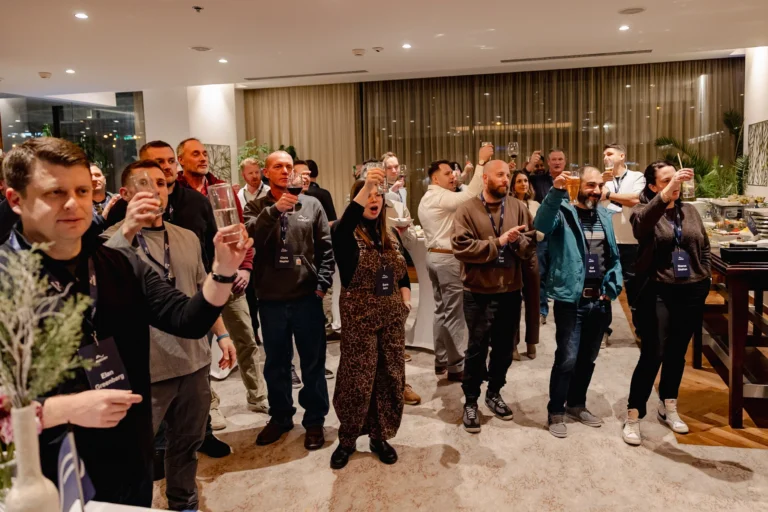 Attendees raising a toast at an evening reception at Hilton Prague Atrium