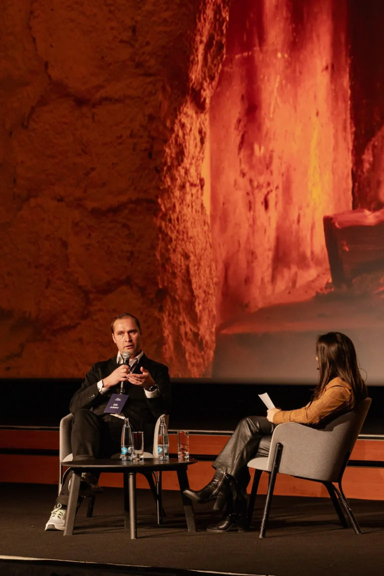 Fireside chat on stage at a company kick-off at Hilton Prague Atrium