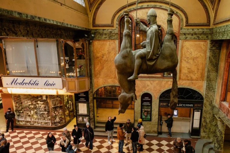Attendees in the Lucerna Passage during a city game in Prague