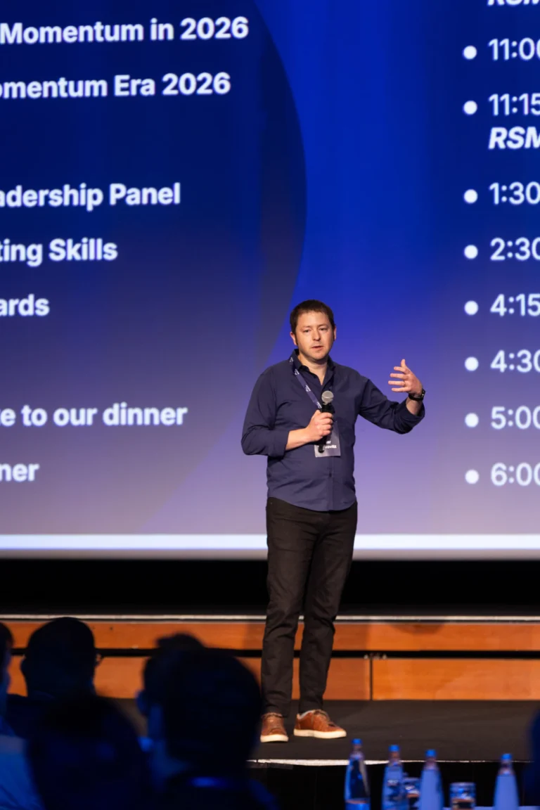 Speaker presenting the day’s agenda at Hilton Prague Atrium